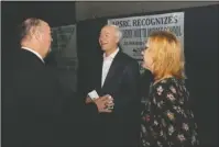  ?? The Sentinel-Record/Richard Rasmussen ?? MEET AND GREET: Gov. Asa Hutchinson, center, speaks with Lake Hamilton School District Superinten­dent Steve Anderson, left, and Hot Springs School District Superinten­dent Stephanie Nehus ahead of the Arkansas Public School Resource Center Fall Conference at the Hot Springs Convention Center Wednesday.