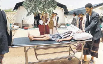  ?? REUTERS ?? A Yemeni boy lies on a stretcher after being injured in an airstrike in Saada on Thursday.