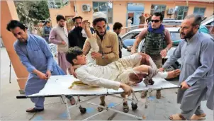  ??  ?? An injured man is taken to a hospital after the bomb blast at a mosque in Jalalabad, Afghanista­n, on October 18, 2019. PARWIZ/REUTERS