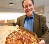  ?? Bloomberg ?? domino’s Pizza Inc awarded CEO Patrick doyle $11.1 million last year, topping it off with $224 for pizza. —