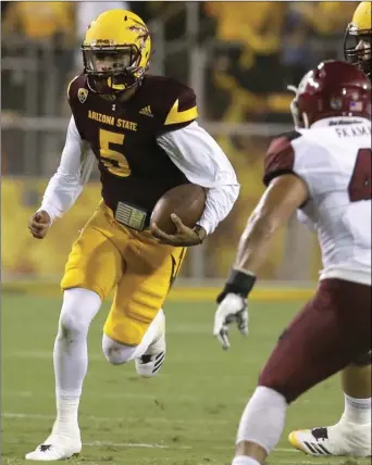  ?? PHOTO/RICK SCUTERI ?? Arizona State quarterbac­k Manny Wilkins against New Mexico State during the first game, Thursday, in Tempe, Ariz. AP