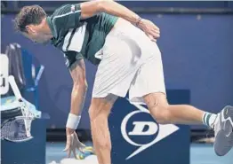  ?? TAIMY ALVAREZ/AP ?? Daniil Medvedev throws his already broken racket during a quarterfin­al loss last week at the Miami Open. Medvedev, 25, was the top seed at the Masters 1000 event.