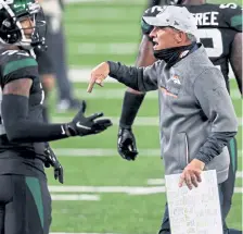  ?? Elsa, Getty Images ?? Broncos coach Vic Fangio yells at his players to get off the field following a win against the New York Jets.