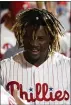  ?? CHRIS SZAGOLA – THE ASSOCIATED PRESS ?? Odubel Herrera, center, here in a quiet moment with Rhys Hoskins in early 2019, has received an invite to spring training with the Phillies.