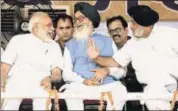  ?? PTI ?? Prime Minister Narendra Modi with former Punjab chief minister Parkash Singh Badal (centre) and SAD chief Sukhbir Singh Badal during the Kisan Kalyan Rally in Malout, Punjab, on Wednesday