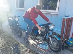  ?? ?? The newly rebuilt Royal Enfield being coaxed into life.