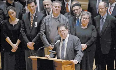  ?? MATT ROURKE/ASSOCIATED PRESS ?? Rabbi Jonathan Perlman speaks at a community gathering Sunday in the Soldiers &amp; Sailors Memorial Hall &amp; Museum in Pittsburgh.