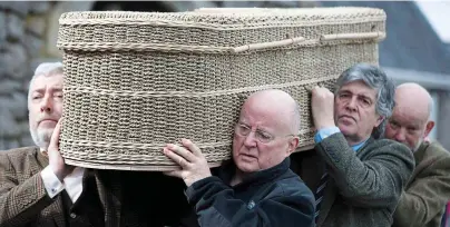  ??  ?? Loss: Christy Moore, second left, was among those carrying the coffin at yesterday’s funeral