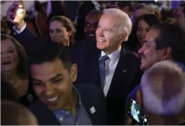  ?? — AFP ?? Democratic presidenti­al candidate former Vice President Joe Biden poses for selfie with a guest prior to the Clark County Democrats Kick Off to Caucus Gala at Tropicana Las Vegas.