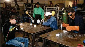  ?? STEVE SCHAEFER / FOR THE AJC ?? Students at Georgia Piedmont Technical College learn welding in Clarkston last month. WorkSource DeKalb and the Technical College System are implementi­ng a program to train and graduate jail inmates for careers in welding like these students are learning.