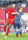  ?? KIM HONG-JI • REUTERS ?? Canada’s Kadeisha Buchanan, left, battles for the ball with with Japan’s Jun Endo during opening game action in women’s soccer at the Tokyo Olympics on Wednesday. The teams tied 1-1.