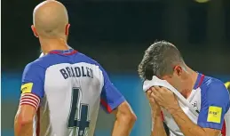  ?? (AFP) ?? Michael Bradley (left) and Christian Pulisic of the US team react after their shock loss to Trinidad & Tobago during the 2018 World Cup CONCACAF qualifier on Tuesday