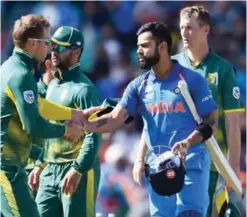  ??  ?? LONDON: India’s captain Virat Kohli (2nd R) shakes hands with South Africa’s David Miller after the ICC Champions Trophy match between South Africa and India at The Oval in London on Sunday. — AFP