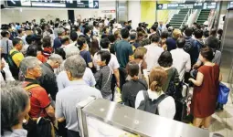  ??  ?? People crowd the New Chitose Airport after the restart of flights were announced, after the area was damaged by an earthquake, in Chitose, Hokkaido, northern Japan, in this photo taken by Kyodo September 7, 2018. (Photo by Kyodo/via Reuters)