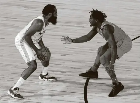  ?? Mike Ehrmann / Associated Press ?? The Rockets' James Harden, left, has found Thunder rookie Luguentz Dort in his face often in their teams’ meetings this season.