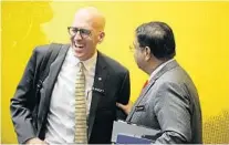  ?? RICARDO RAMIREZ BUXEDA/ORLANDO SENTINEL ?? UCF interim President Thad Seymour, left, talks with Board of Trustees member Danny Gaekwad after a meeting on Thursday.