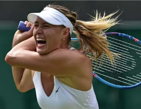  ?? LEON NEAL/AFP/GETTY IMAGES ?? With her career sidelined first by a drug suspension and then by injury, Maria Sharapova still has her sights set on returning to the top of the tennis world.