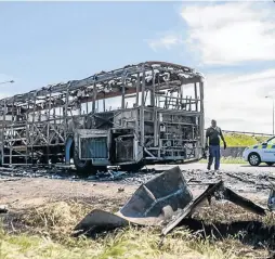  ?? / ANTHONY MOLYNEAUX ?? The shell of a MyCiti bus that was set alight in Cape Town during the taxi strike yesterday.