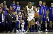  ?? RAY CARLIN — THE ASSOCIATED PRESS ?? Baylor guard Jared Butler dribbles up court against Kansas during a game in Waco, Texas on Feb. 22. Baylor opens this season only one poll point behind top-ranked Gonzaga in the AP Top 25.