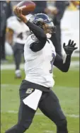  ?? AP photo ?? Robert Griffin III of the Ravens passes during the first half Wednesday.