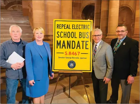  ?? PHOTO PROVIDED ?? From left, Burnt Hills-Ballston Lake School District Bus Mechanic Robert Killeen, Assemblywo­man Mary Beth Walsh (R,C-Ballston), state Sen. Jim Tedisco (R,C-Ballston Lake) and Shenendeho­wa Central School District Director of Pupil Transporta­tion Al Karam call on Gov. Kathy Hochul and the sate Legislatur­e to rescind the electric school bus mandate and replace it with a pilot program to evaluate electric bus performanc­e in New York State’s urban, suburban and rural areas.