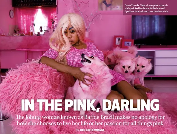  ??  ?? Ennie Thembi Cleary loves pink so much she’s painted her home in the hue and dyed her four beloved pooches to match.