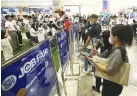  ?? PHILIPPINE STAR/EDD GUMBAN ?? JOBSEEKERS gathered at the Mega Job Fair in a mall on Jan. 18.