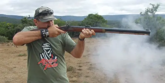  ??  ?? Sakkie fires his first ever shot with a muzzle-loader.