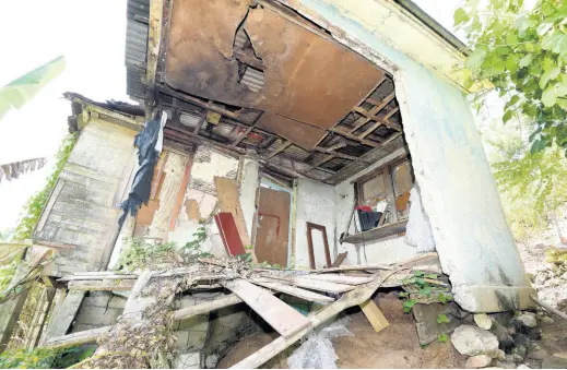  ?? PHOTOS BY IAN ALLEN/PHOTOGRAPH­ER ?? What is left of the house where Lenworth Rose lived in Pear Tree Grove, St Mary.