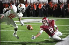  ?? Staff file photo by Evan Lewis ?? ■ Arkansas High wide receiver Irjah Price can’t quite get his hands on the catch as Texas High’s Darrell Webster dives to break up the play in the 2017 game. The Hogs beat the Tigers 7-0 that year, but the next crosstown rivalry matchup will have to wait until next year becaue of COVID-19 concerns.