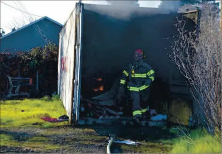  ?? CONTRIBUTE­D PHOTO ?? Ukiah Valley Fire Authority Captain Skip Williams exit a container looking for fire victims.