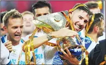  ??  ?? Javi Garcia of Zenit Saint Petersburg celebrates with the trophy of the Russian Super Cup football match between CSKA Moscow and Zenit atthe Lokomotiv Stadium in Moscow on July 23. (AFP)