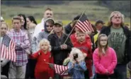  ?? EVAN VUCCI — ASSOCIATED PRESS ?? People attending the Sept. 11Flight 93 Memorial Service in Shanksvill­e, Pa., on Tuesday wave American flags.