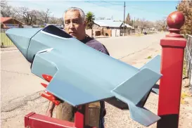 ?? ?? Vince Mora describes his mailbox, which is shaped to model a Lockheed Martin F-35 Lightning II. It’s made of fire extinguish­ers.