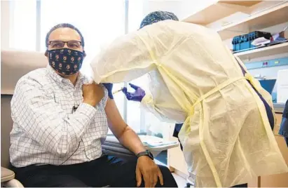  ?? MATTHEW PAUL D’AGOSTINO/COURTESY PHOTO ?? Dr. Freeman Hrabowski, president of UMBC, receives a Moderna mRNA COVID-19 vaccine as a participan­t in a clinical trial.