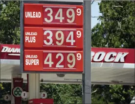  ?? DAVID ZALUBOWSKI — THE ASSOCIATED PRESS ?? Prices for the three grades of gasoline available are posted outside a Diamond Shamrock station in Denver last mont. Colorado motorists are dealing with some of the highest prices at the pump in more than decade.