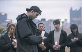  ?? Stephanie Strasburg/Post-Gazette ?? Pitt student Harry Leibovitz, center, 19, of Oakland, who also goes by MmmCherry, sings over his track “Stronger Than Hate” as he and friends film a music video in response to the trauma and grief Pittsburgh experience­d in the wake of the Tree of Life Synagogue shootings.To hear the song, go to post-gazette.com.