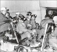  ?? ASSOCIATED PRESS 1968 ?? A seven-man rescue team enters the Consolidat­ion Coal Mine No. 9 in Farmington, W.Va., in November 1968 after 78 miners were trapped inside following an explosion. Families of the men who died in the mine will try this week to revive a wrongfulde­ath...