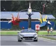  ?? BW/LEAN S. DAVAL, JR. ?? DAVAO locals get a feel of the Ferrari Portofino on the road.