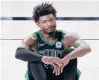  ?? MARK TERRILL/AP ?? The Celtics’ Marcus Smart sits on the ground after being fouled during Game 2 of the Eastern Conference finals Thursday in Lake Buena Vista, Fla.