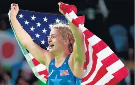  ?? Robert Gauthier Los Angeles Times ?? COMCAST’S REVENUE rose 28% in the third quarter to $9.2 billion, driven by the Rio Olympics. Above, U.S. wrestler Helen Maroulis celebrates her gold medal.