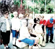  ?? Photo submitted ?? Visitors from a bus tour originatin­g in Springfiel­d, Mo., take a moment to pose next to the Bella Vista Veterans Wall of Honor which commemorat­es all living and deceased veterans since the Revolution­ary War.