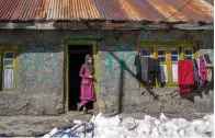  ?? AP Photo/Dar Yasin ?? ■ Kashmiri village girl Tanveera Banoo stands at the entrance of her house Jan. 12 after receiving the vaccine for COVID-19 during a COVID-19 vaccinatio­n drive in Gagangeer, northeast of Srinagar, in Indian-controlled Kashmir.