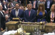  ??  ?? Britain’s MPs in the House of Commons read out the results of a vote on the so-called new clause 17 amendment, marking the government’s first defeat on the Brexit trade bill, on Tuesday. PARLIAMENT­ARY RECORDING UNIT VIA AP