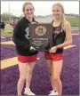  ?? Courtesy photograph ?? Lady Blackhawks Lauren Wright and Blakelee Winn show off the Champions plaque earned by the Lady Blackhawks track team at the District meet this past week.