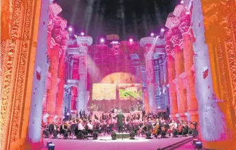  ?? — AFP photo ?? Maestro Harout Fazlian conducts rehearsals ahead of the Sound of Resilience concert inside the Temple of Bacchus at the historic site of Baalbek in Lebanon’s eastern Bekaa Valley.