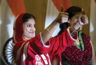  ?? MANISH SWARUP/THE ASSOCIATED PRESS FILE PHOTO ?? Twelve years ago, Geeta, now 23, a deaf and mute Indian woman, crossed the Indian border into Pakistan. Last month, finally, she flew home to a warm and emotional welcome. She gives a thumbs-up at a press conference in New Delhi.