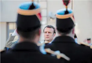  ?? FRANCOIS MORI AGENCE FRANCE-PRESSE ?? French President Emmanuel Macron reviews troops before delivering a speech to graduating military officers at the École Militaire in Paris. The keynote was aimed at projecting strength.