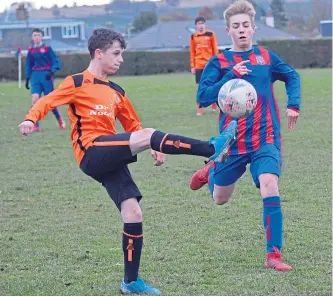  ??  ?? Dundee West (red/blue) beat DUSC in the U/15 Tommy Clark Trophy first round at Charlotte Street.