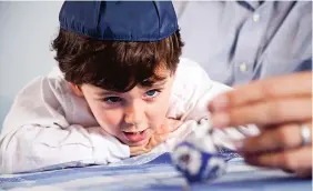  ?? GETTY IMAGES ?? Research suggests that humor and storytelli­ng can contribute to a child’s success, Jewish author Marjorie Ingall writes, and both are central to Jewish culture.